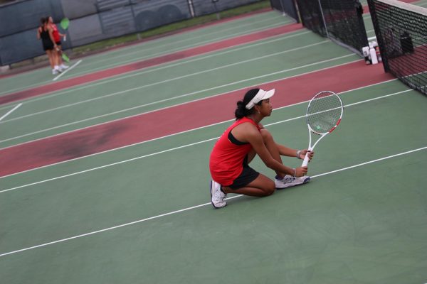 Makayla Gonzalez warms up for a tennis game.