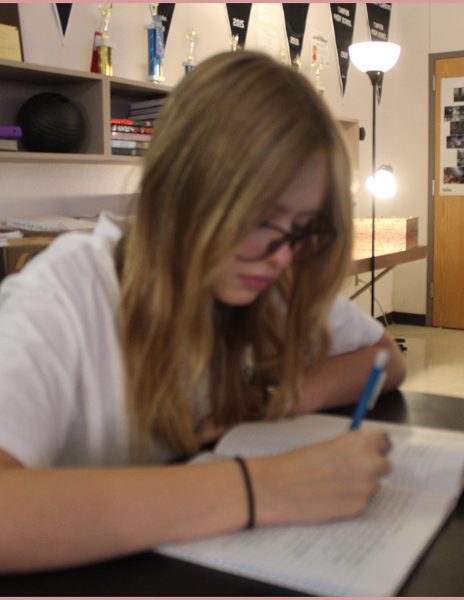 Sophomore Denali Abbott works on homework from her American Sign Language Class.